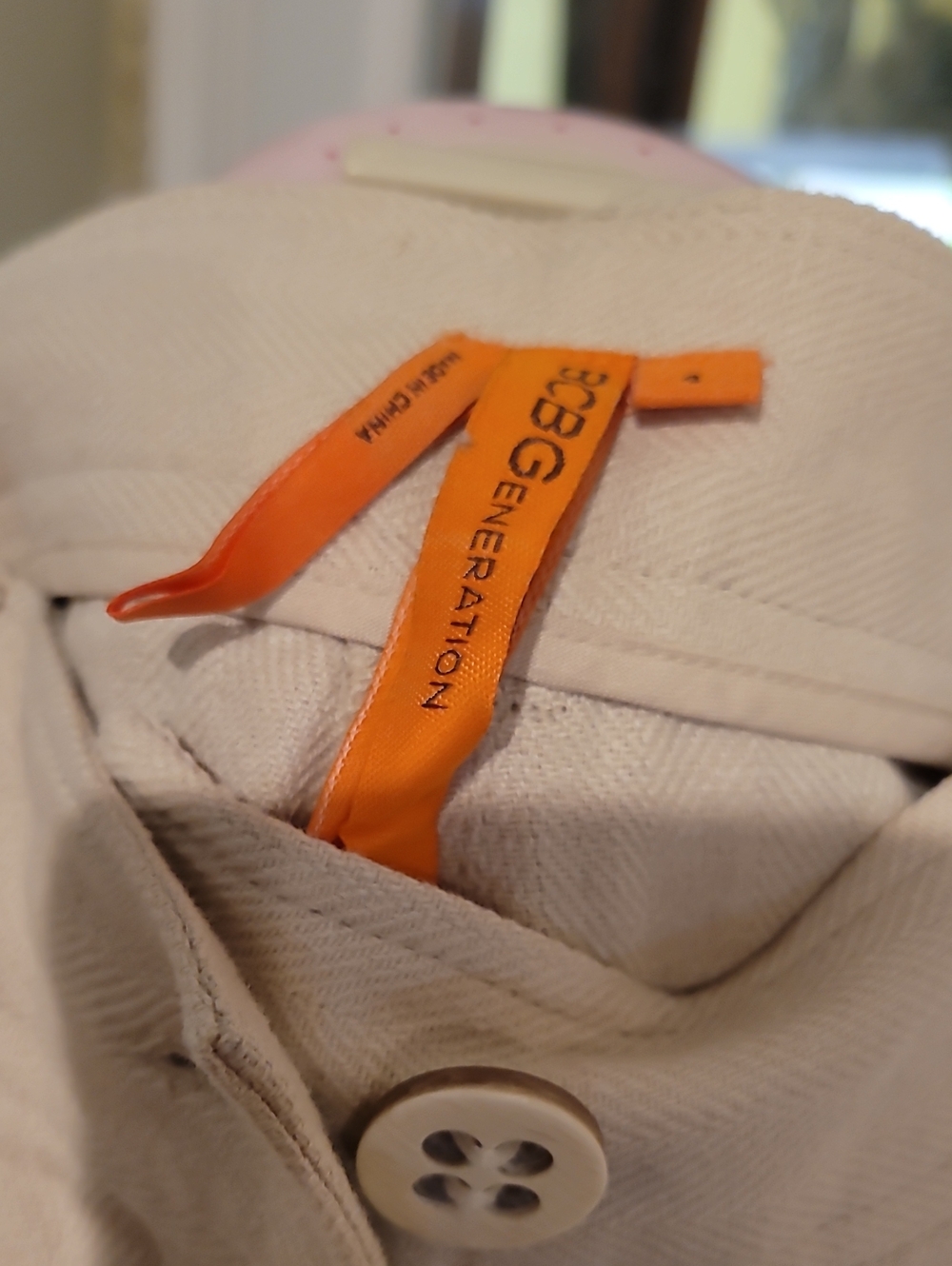 BCBGeneration Cropped Ankle Pants in Cream with Orange Brand Tag